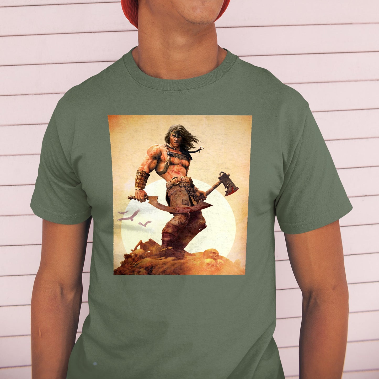 Age of Conan King Conan tee worn by a model in a cap, green