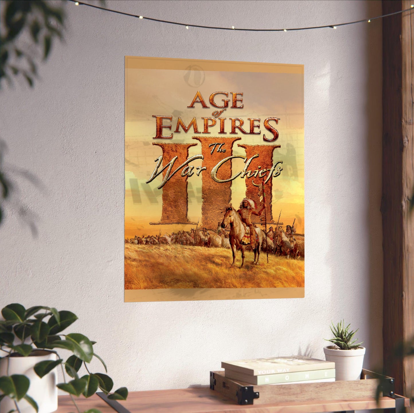 Age of Empires III The WarChiefs cover art unframed on a white wall above a desk