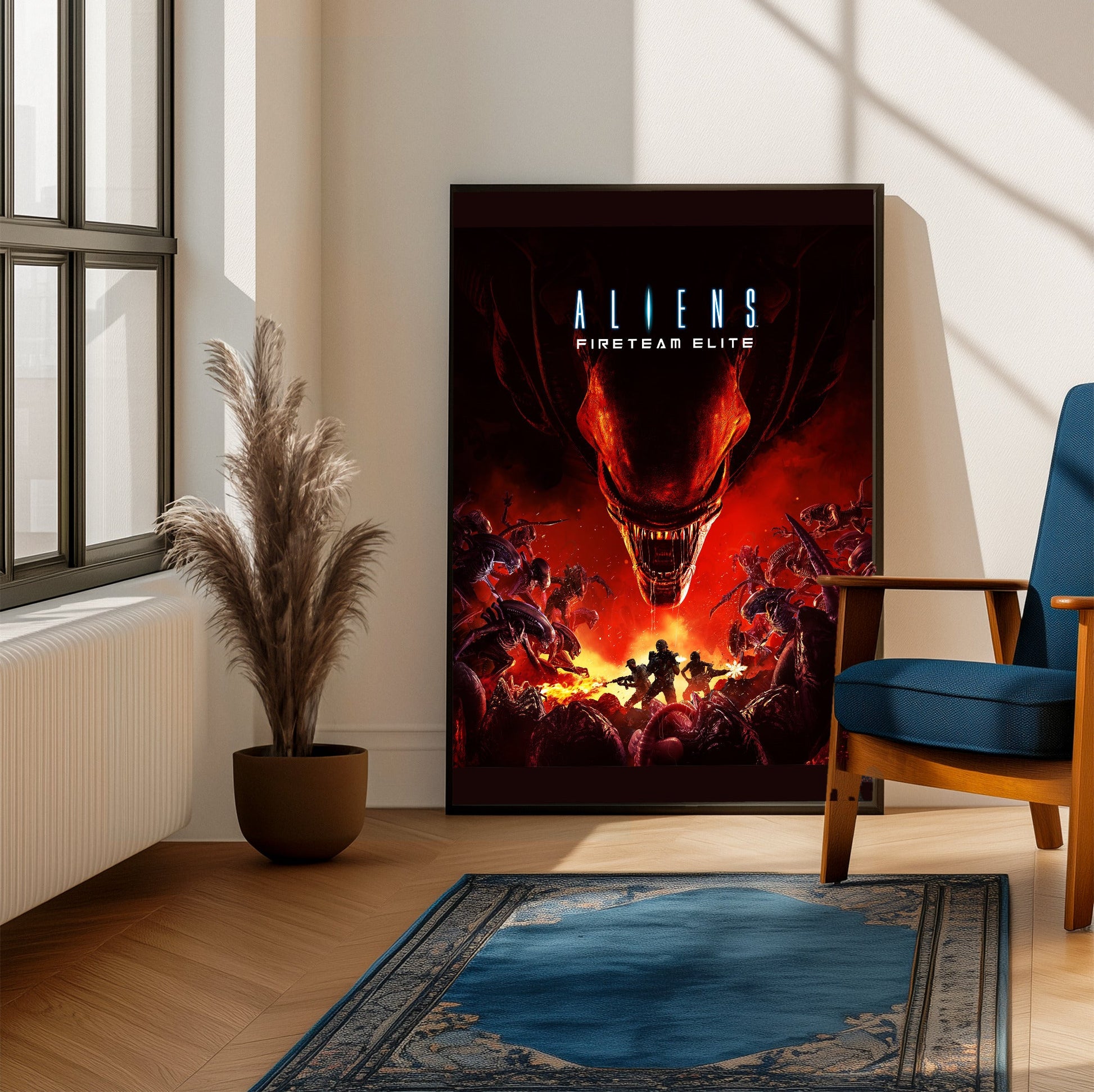 Aliens Fireteam Elite cover art framed beside a blue armchair in a sunlit room
