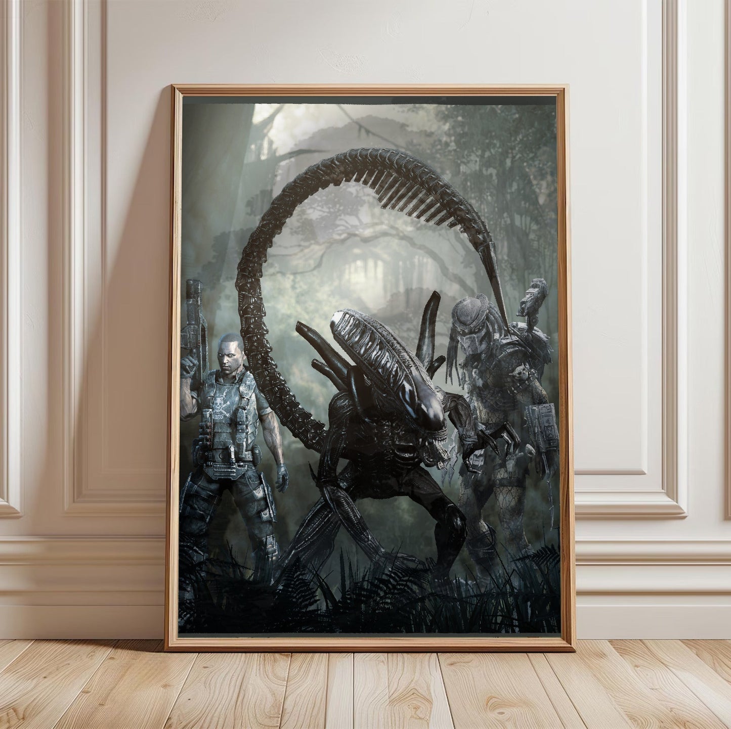 Aliens vs. Predator 2010 alien promo art in a light oak frame leaning against a white wall
