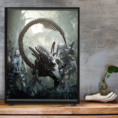 Aliens vs. Predator 2010 alien promo art in a black frame on a wooden shelf against concrete