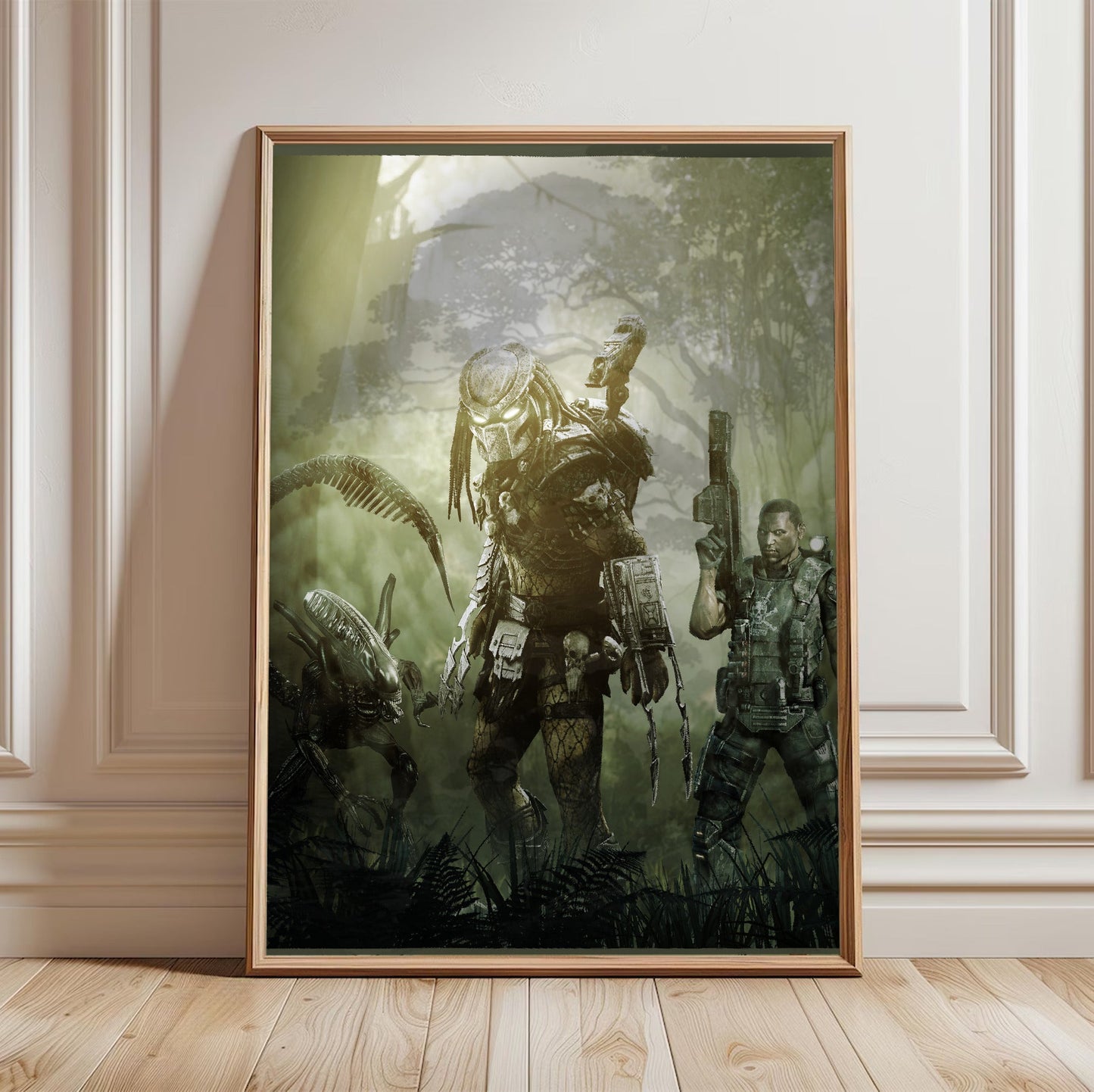 Aliens vs. Predator 2010 predator promo art in a light oak frame leaning against a white wall