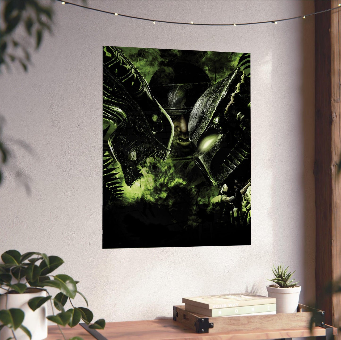 Aliens vs. Predator 2010 promotional art unframed on a white wall above a desk