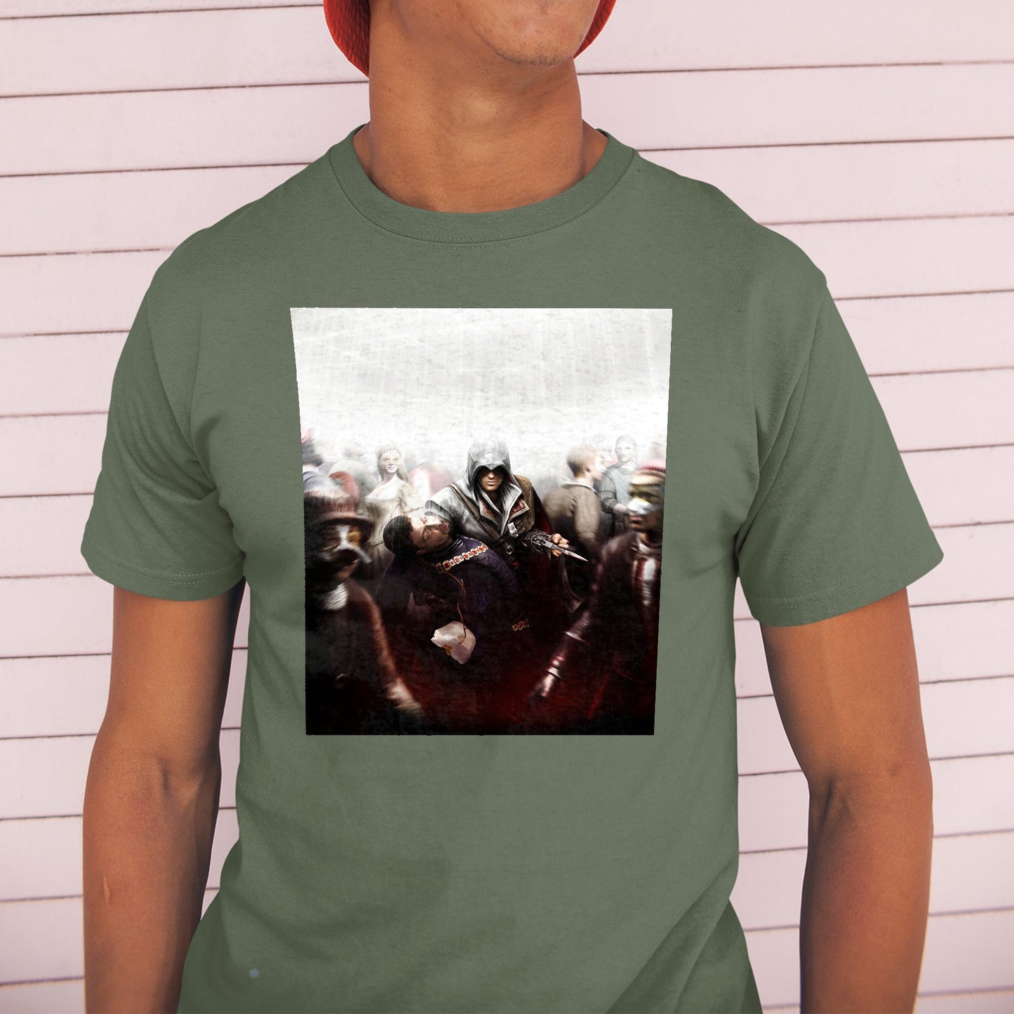 Assassin's Creed II assassination promo art tee worn by a model in a cap, green