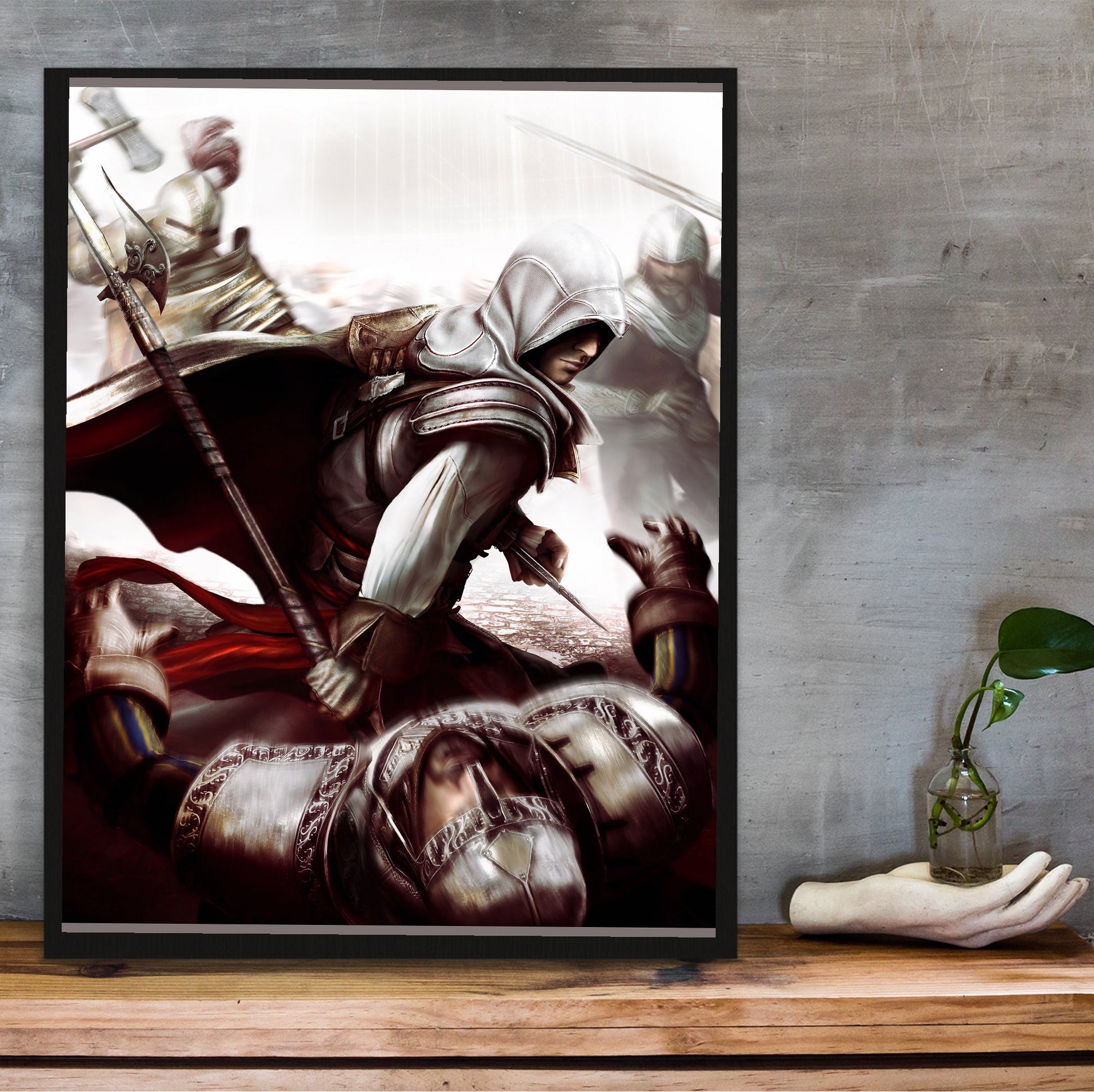 Assassin's Creed II Ezio fighting guards art in a black frame on a wooden shelf against concrete