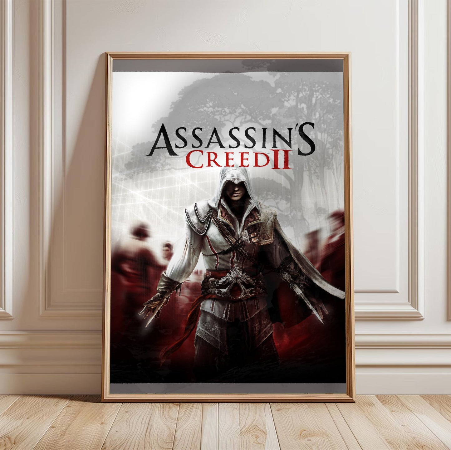 Assassin's Creed II key art in a light oak frame leaning against a white wall