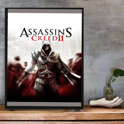 Assassin's Creed II key art in a black frame on a wooden shelf against concrete