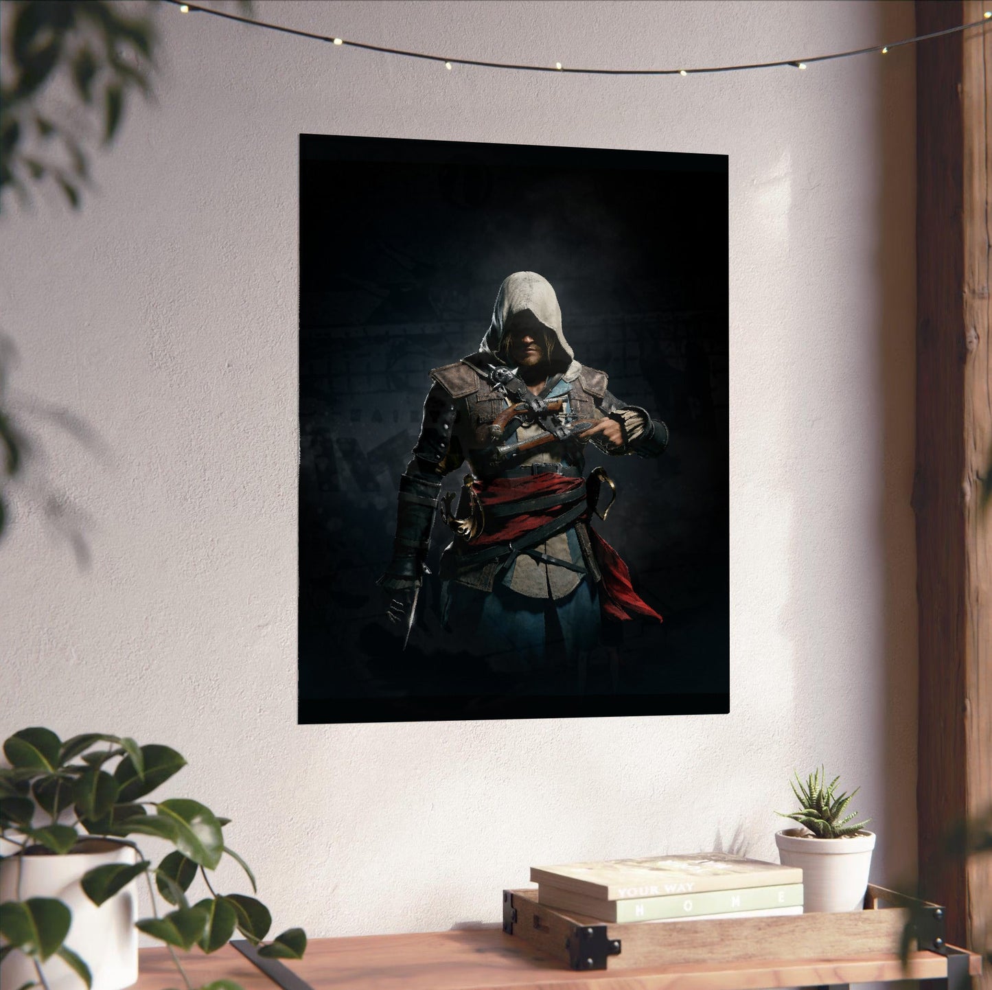 Assassin's Creed IV Black Flag Edward Kenway art unframed on a white wall above a desk