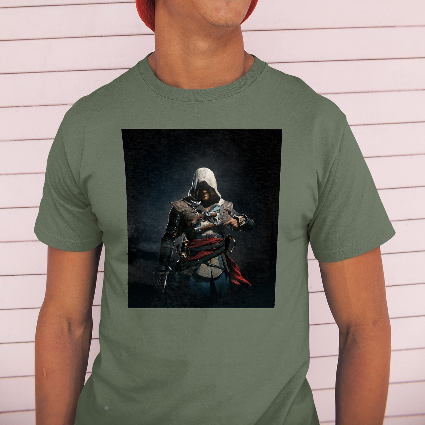 Assassin's Creed IV Black Flag Edward Kenway tee worn by a model in a cap, green