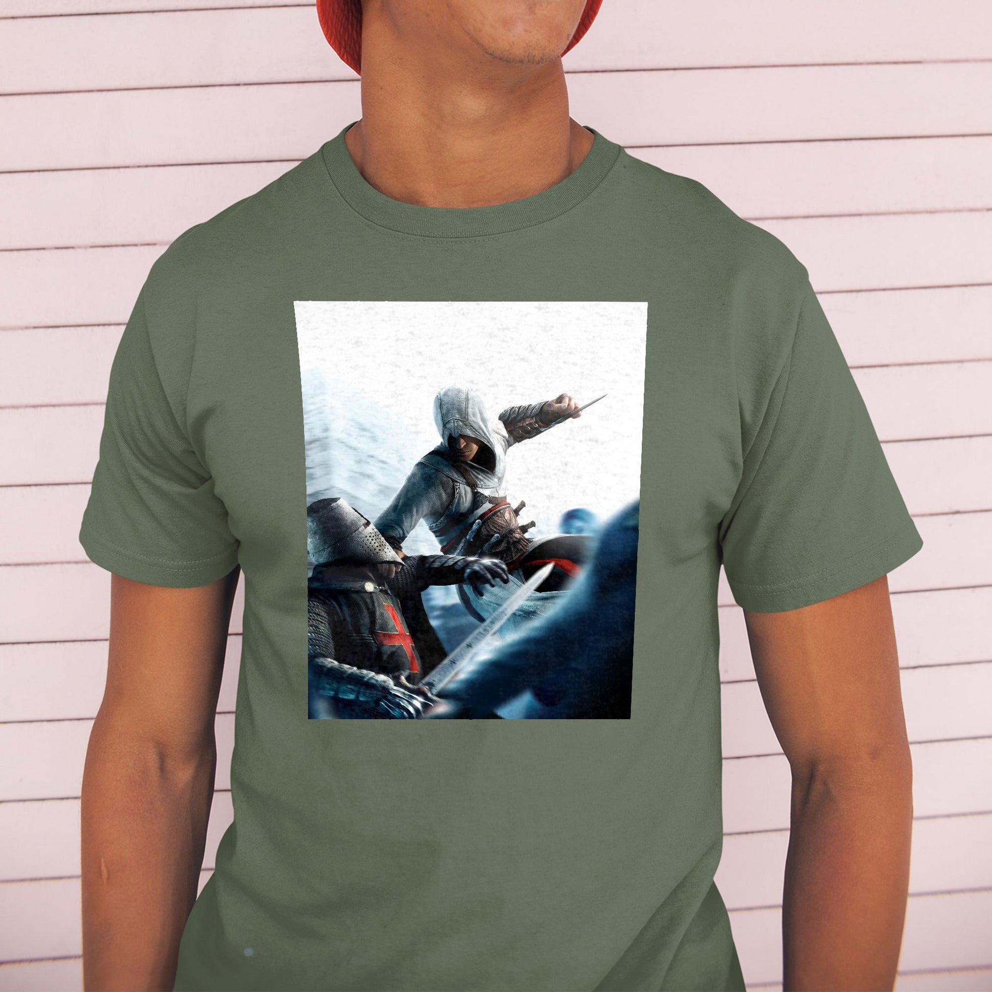 Assassin's Creed assassin vs Templar concept art tee worn by a model in a cap, green