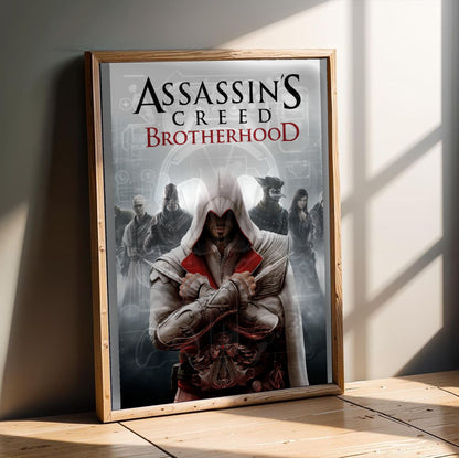 Assassin's Creed Brotherhood cover art in an oak frame leaning on a wooden floor