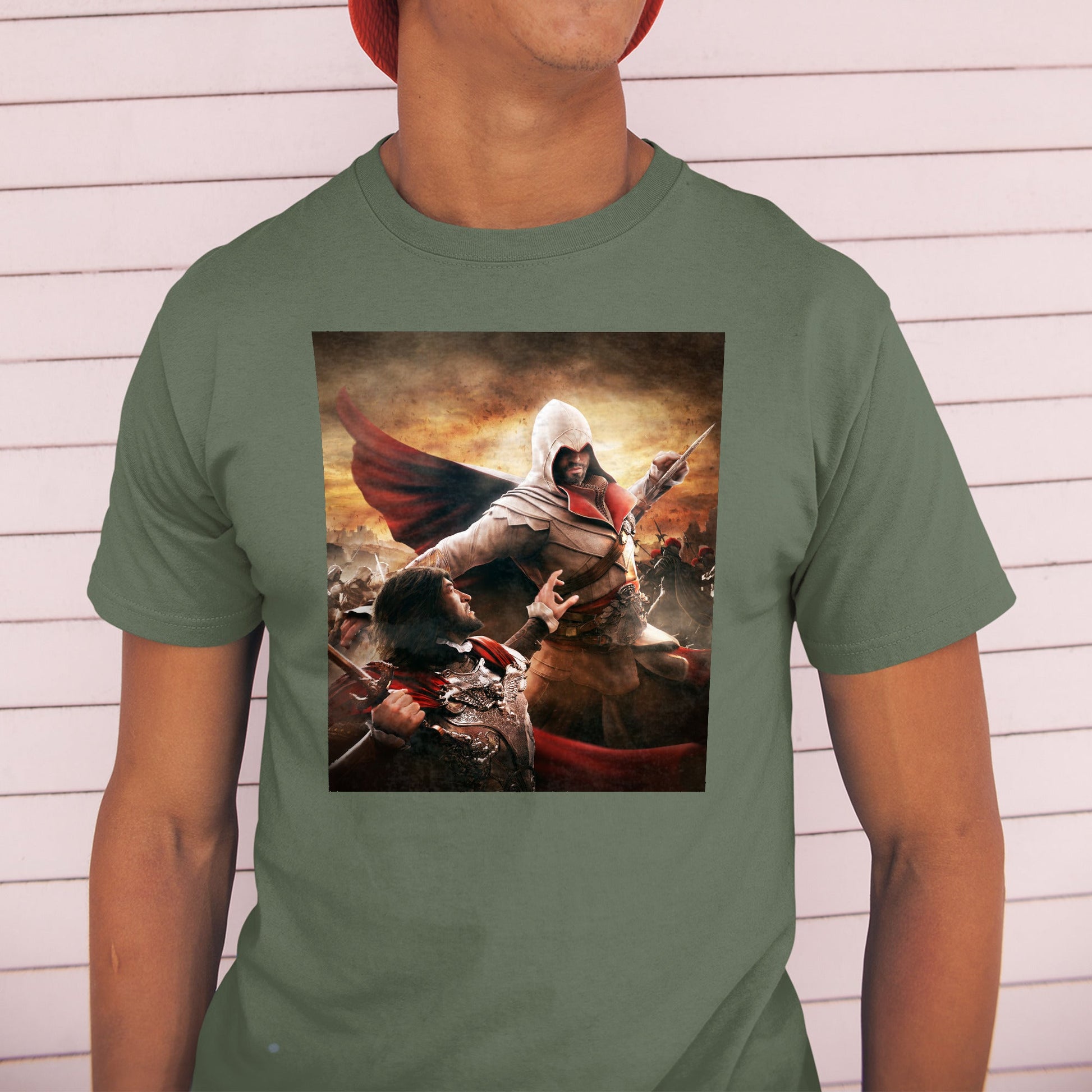 Assassin's Creed Brotherhood Ezio vs Cesare Borgia tee worn by a model in a cap, green