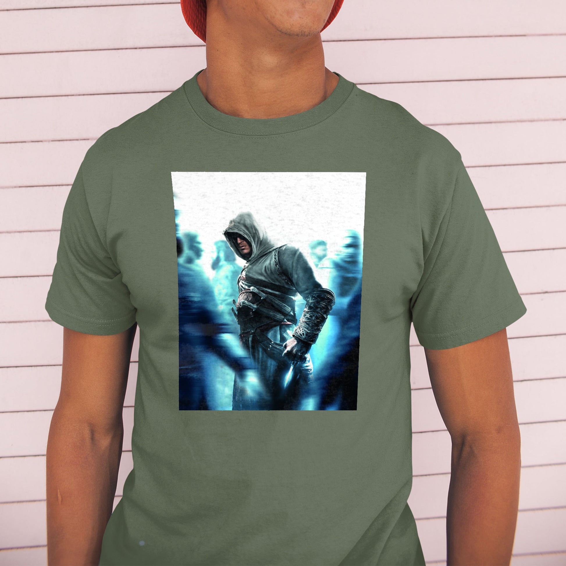 Assassin's Creed crowd key art tee worn by a model in a cap, green