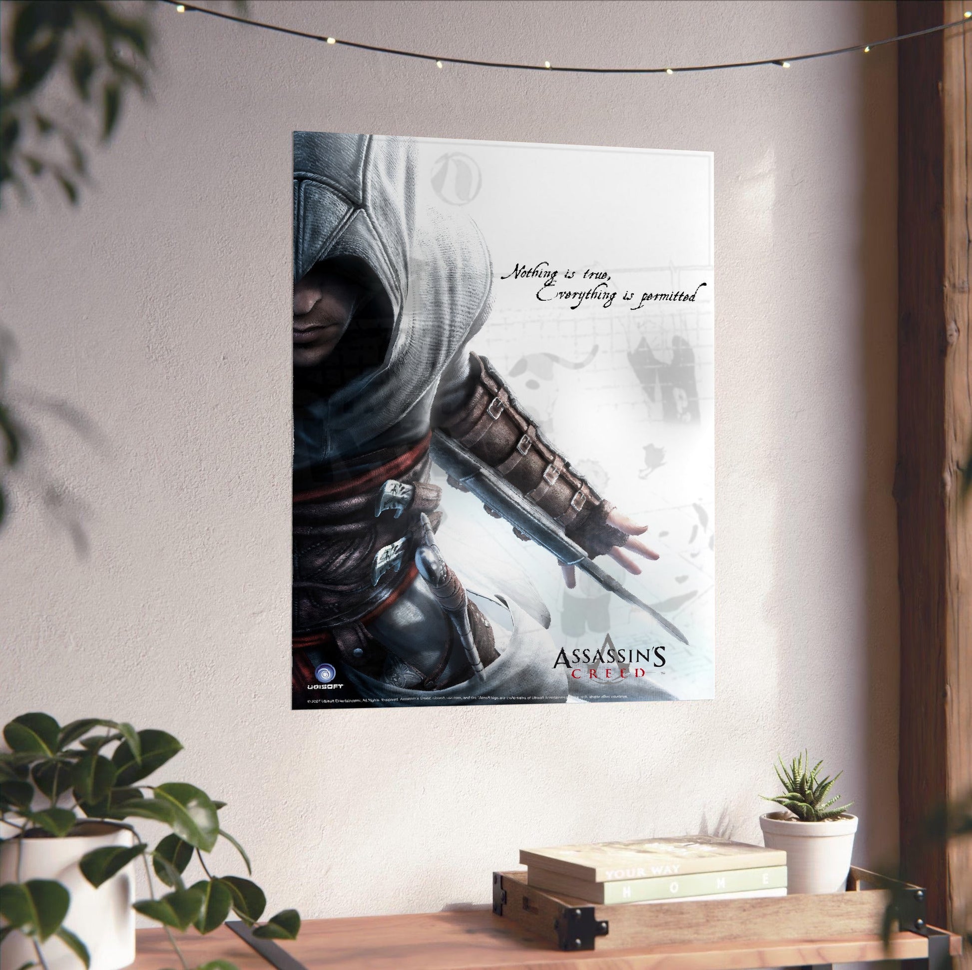 Assassin's Creed Altair promotional art unframed on a white wall above a desk