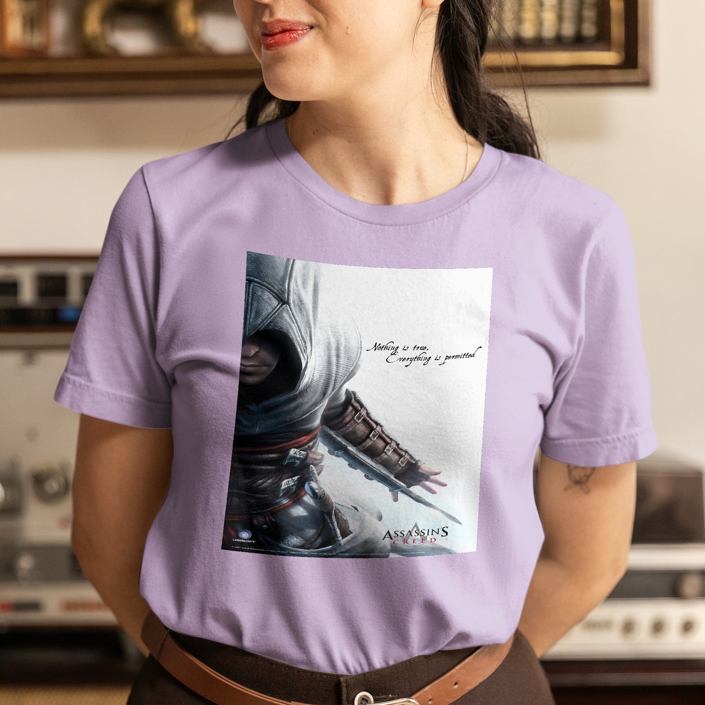 Assassin's Creed Nothing Is True promo art tee worn by a model, violet