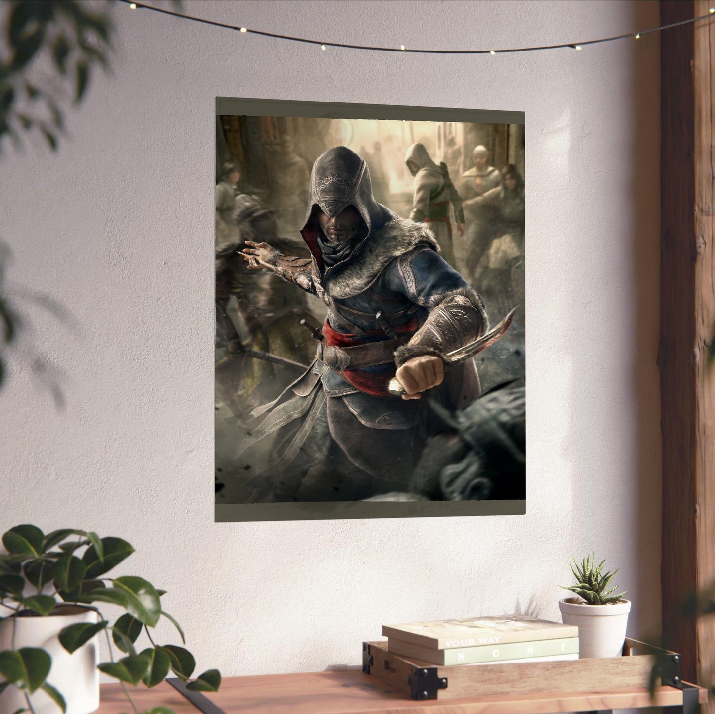 Assassin's Creed Revelations Ezio art unframed on a white wall above a desk