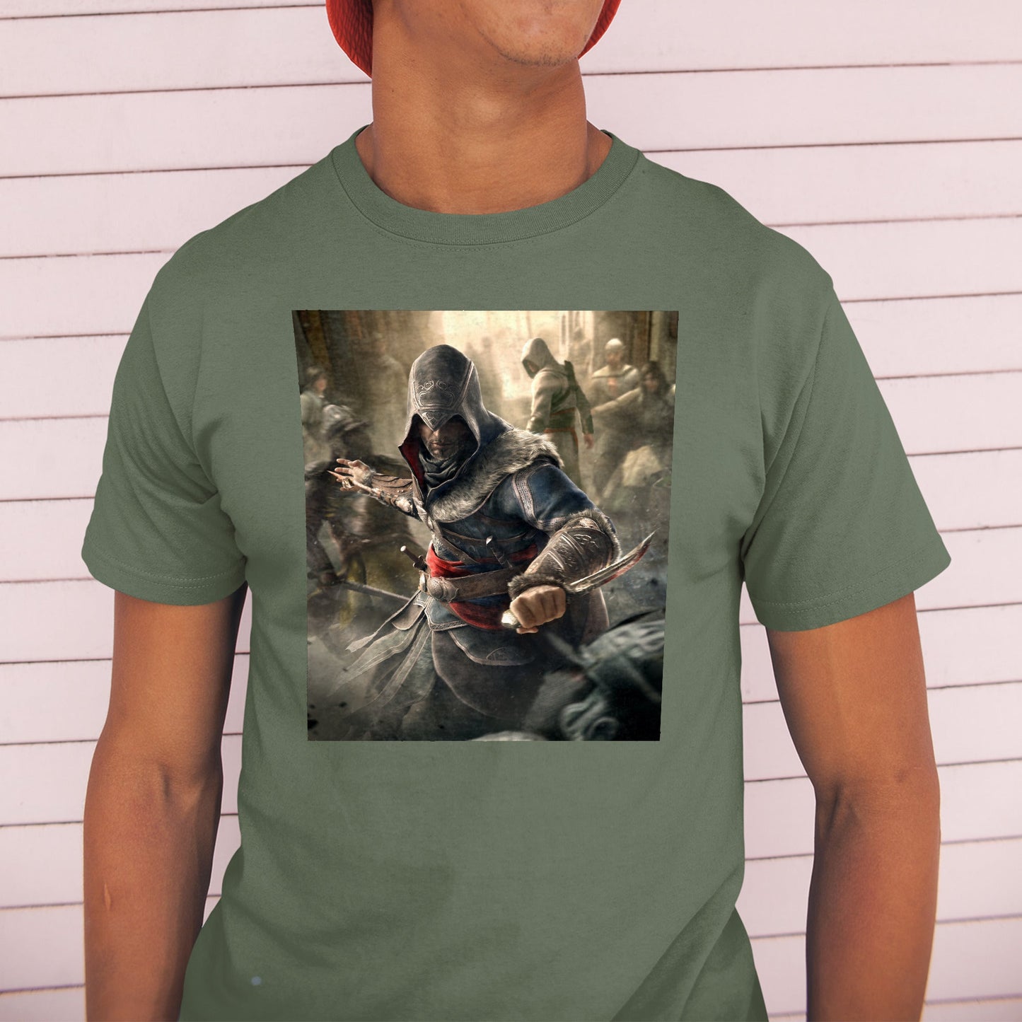 Assassin's Creed Revelations Ezio poster art tee worn by a model in a cap, green