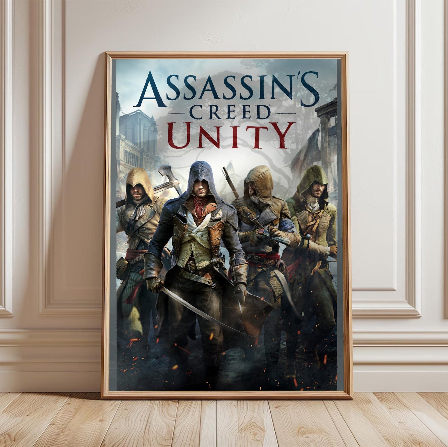 Assassin's Creed Unity cover art in a light oak frame leaning against a white wall
