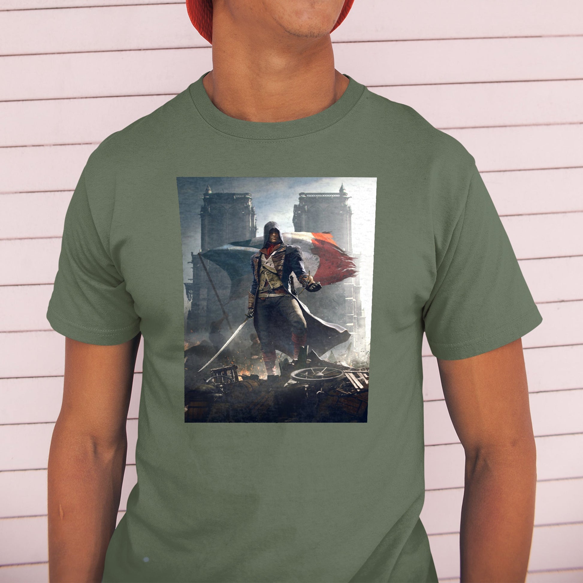 Assassin's Creed Unity key artwork tee worn by a model in a cap, green