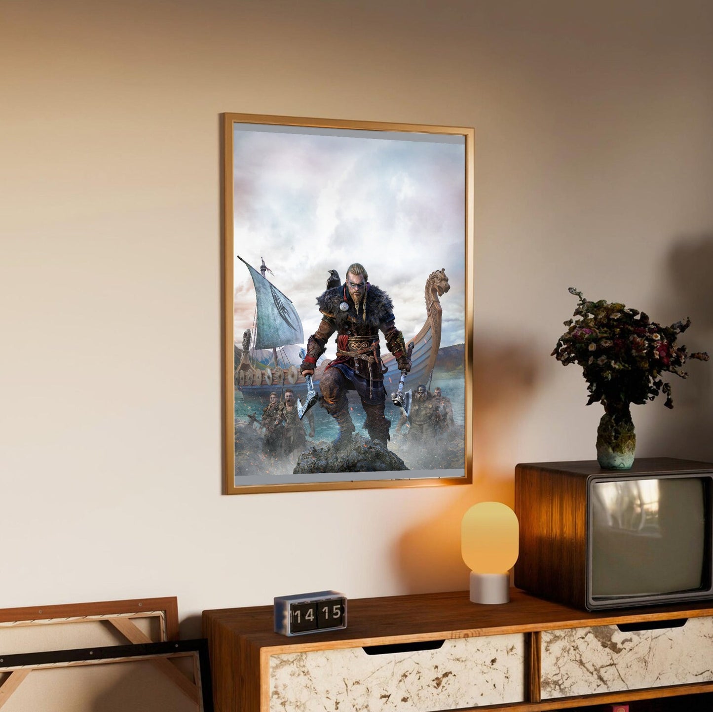 Assassin's Creed Valhalla cover art in an oak frame above a sideboard