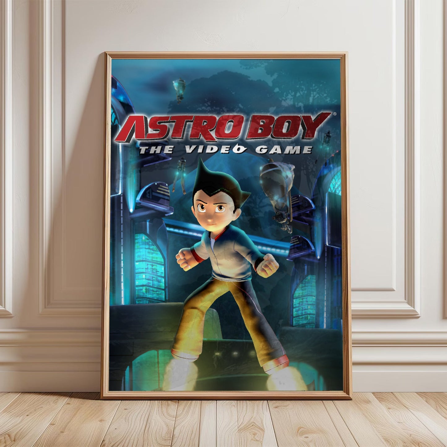 Astro Boy The Video Game key art in a light oak frame leaning against a white wall