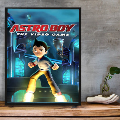 Astro Boy The Video Game key art in a black frame on a wooden shelf against concrete