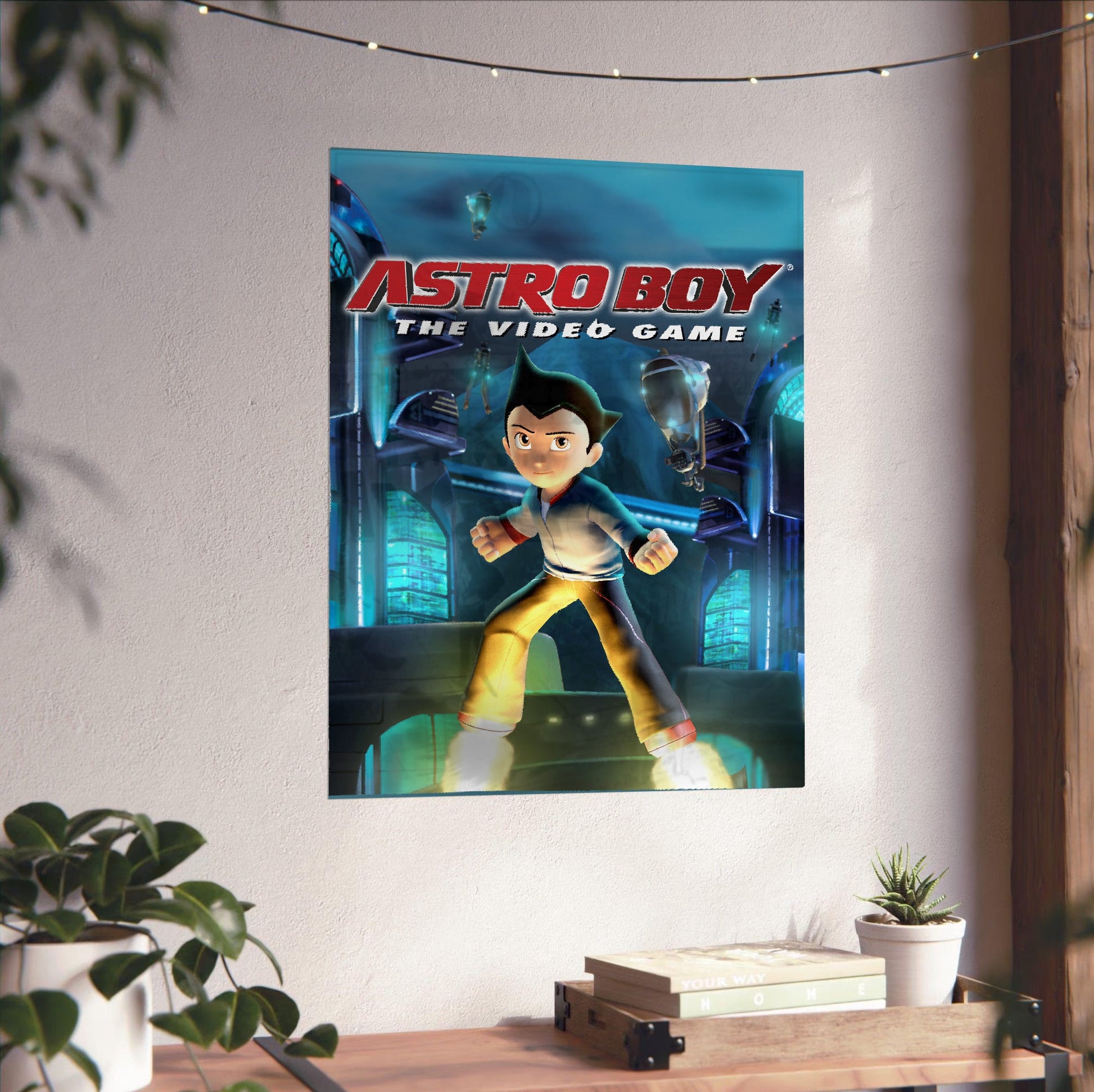 Astro Boy The Video Game key art unframed on a white wall above a desk