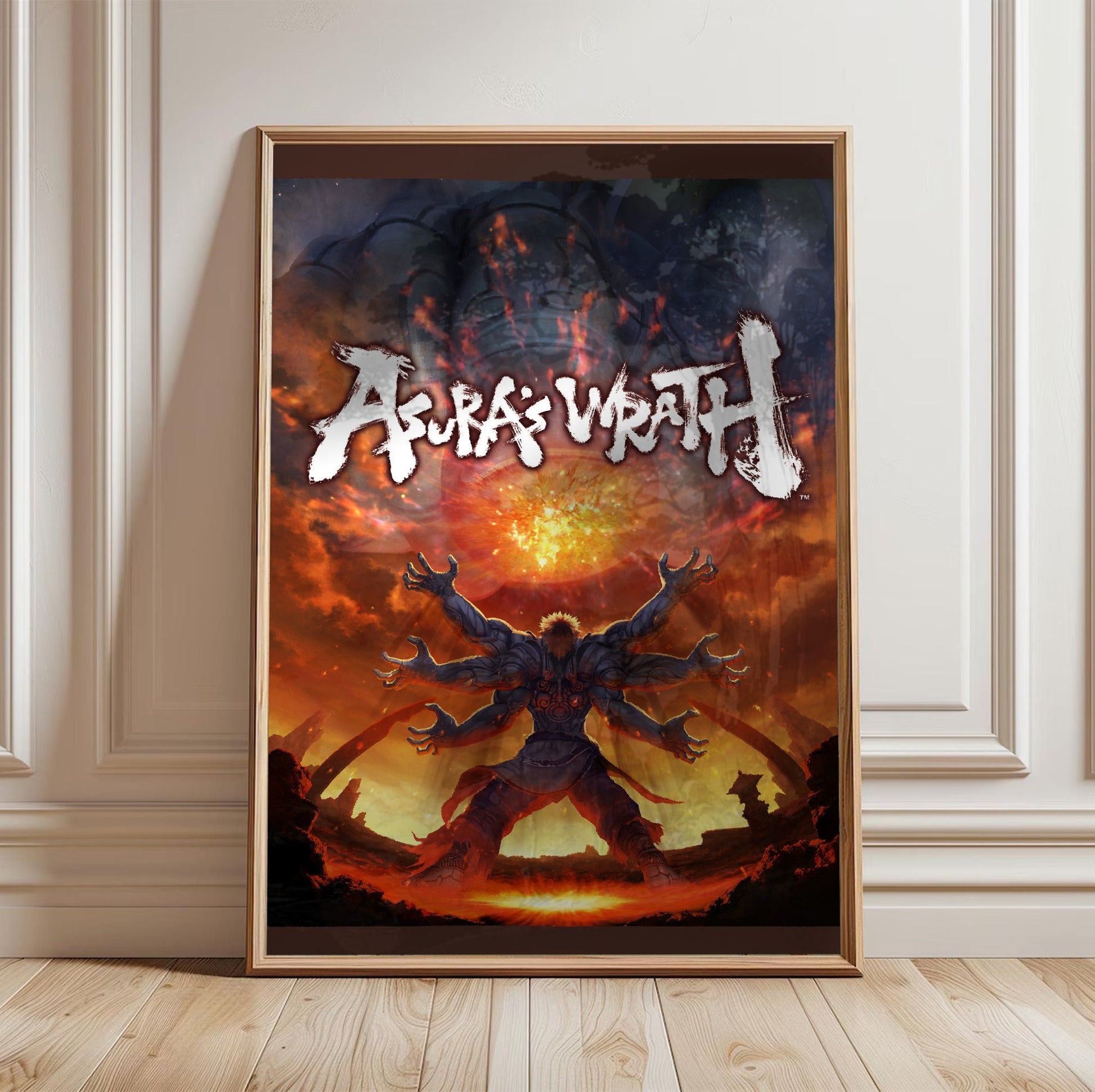 Asura's Wrath E3 artwork with logo in a light oak frame leaning against a white wall