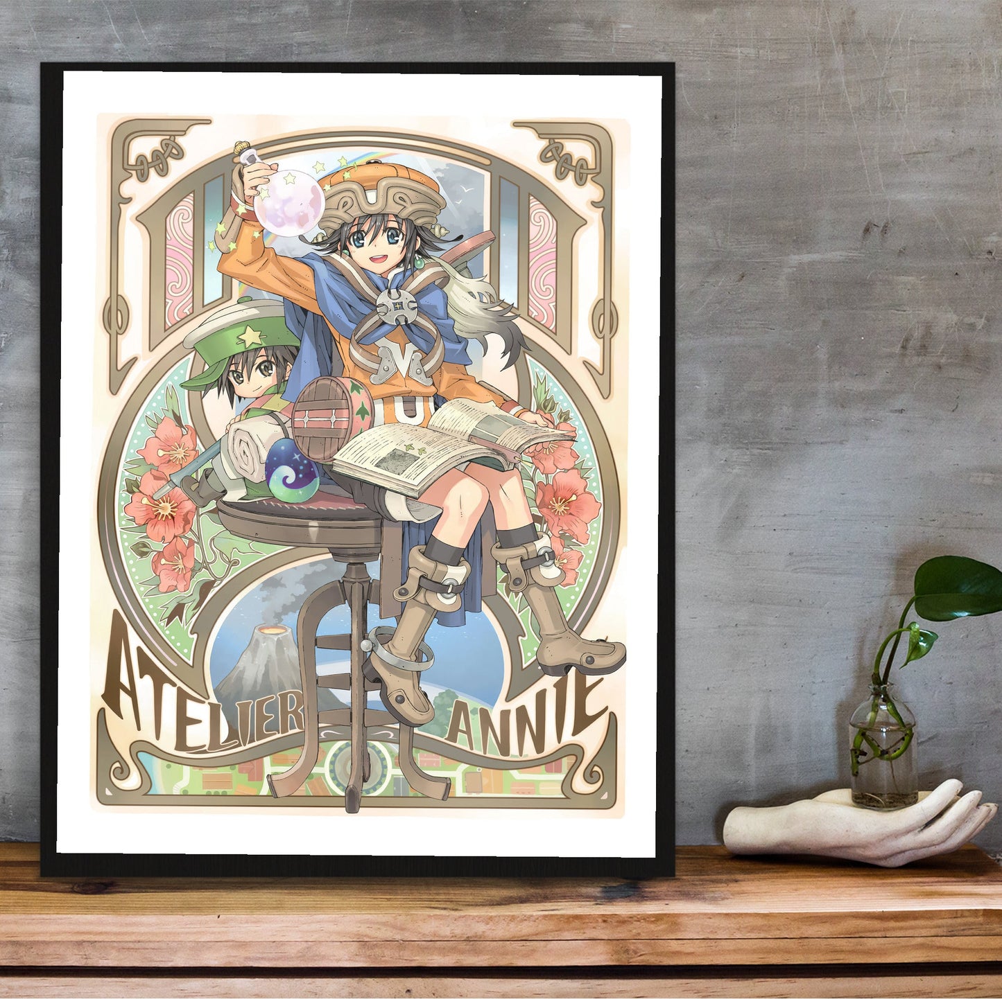 Atelier Annie Alchemists of Sera Island Official Cover Art in a black frame on a wooden shelf against concrete