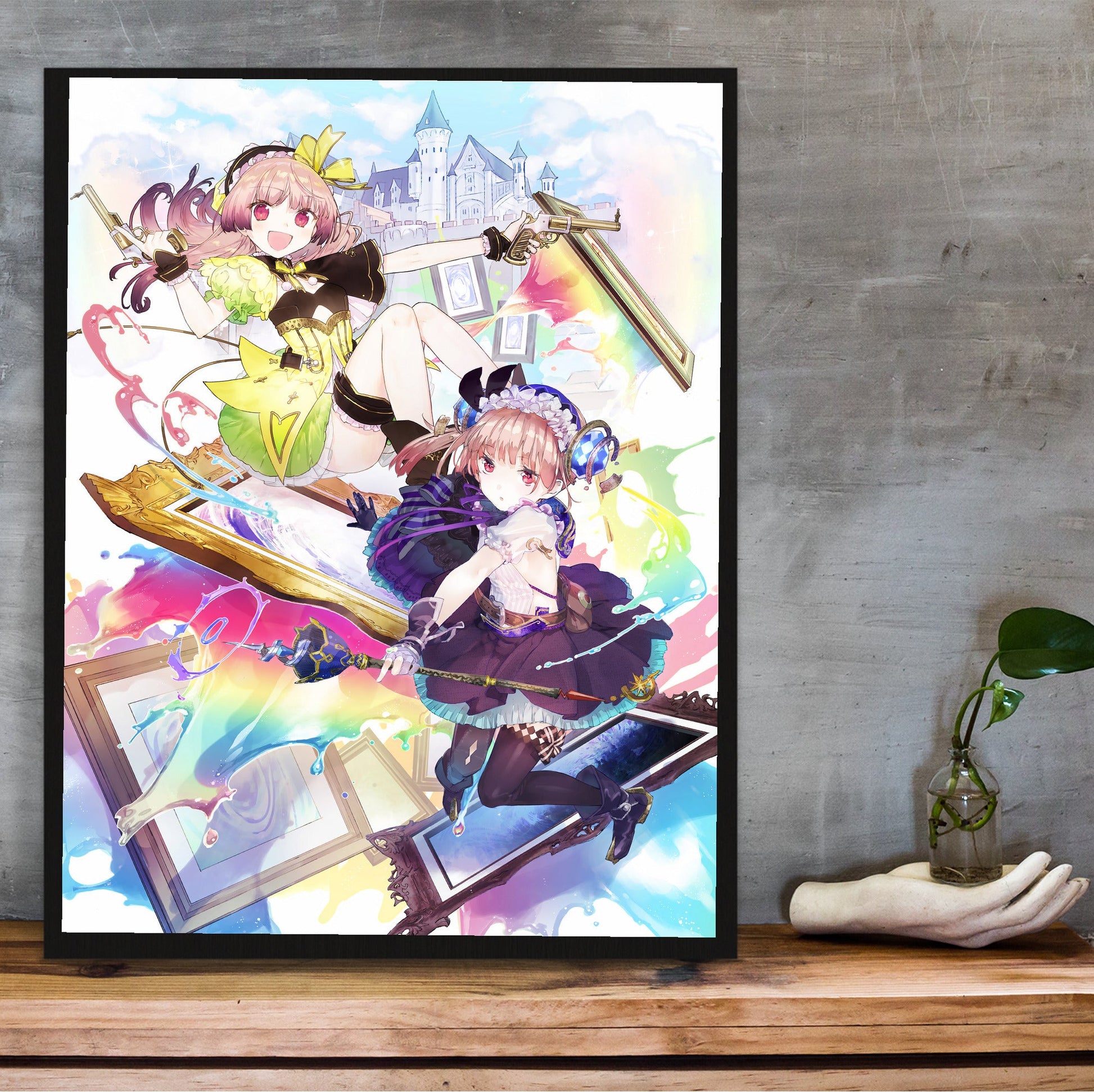 Atelier Lydie and Suelle The Alchemists and the Mysterious Paintings Official Key Art in a black frame on a wooden shelf against concrete