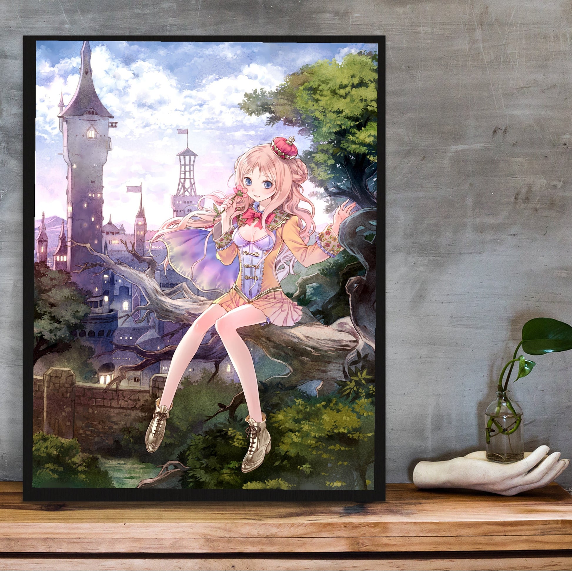 Atelier Meruru The Apprentice of Arland Cover Art by Mel Kishida in a black frame on a wooden shelf against concrete