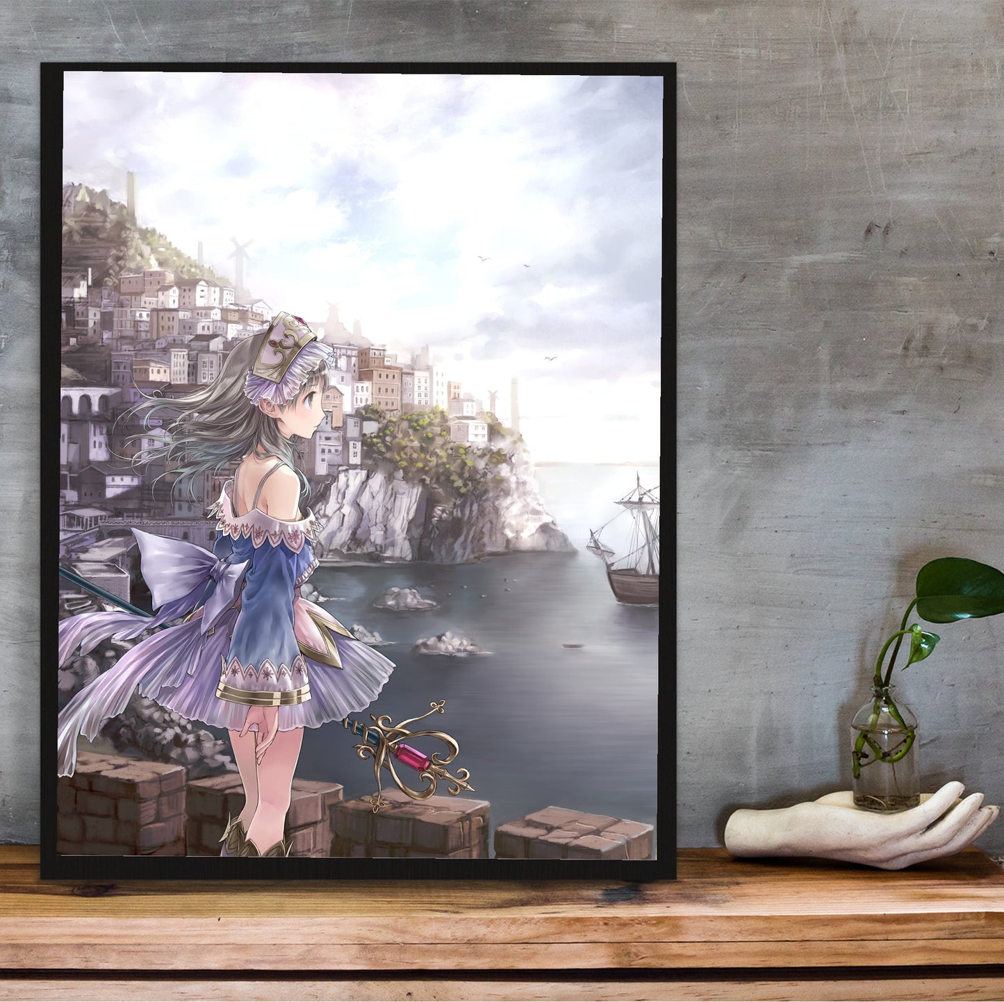 Atelier Totori The Adventurer of Arland US Cover Art in a black frame on a wooden shelf against concrete