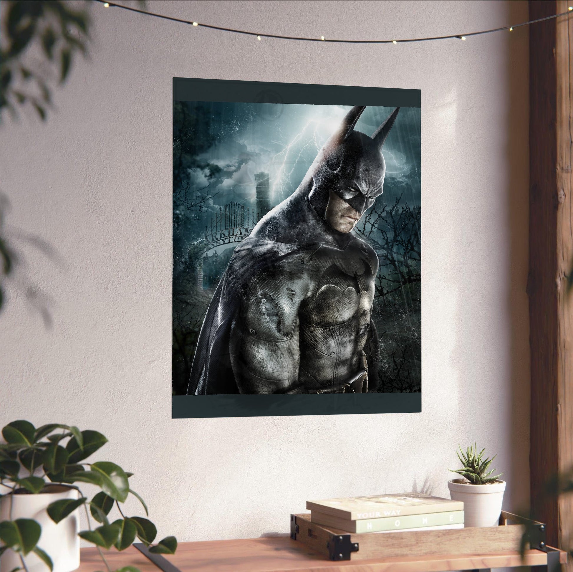 Batman Arkham Asylum official key art poster unframed on a white wall above a desk