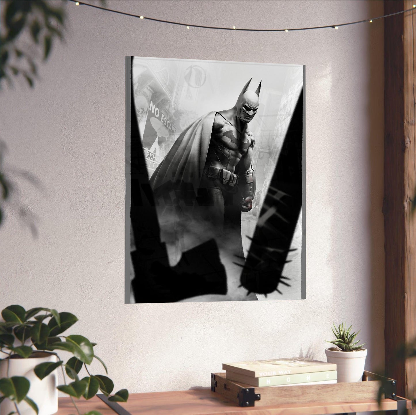 Batman Arkham City Batman vs thugs art poster unframed on a white wall above a desk