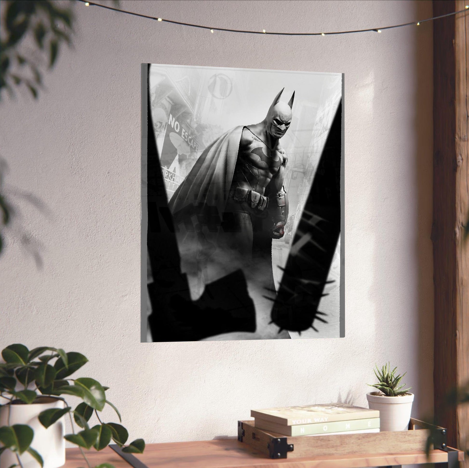 Batman Arkham City Batman vs thugs art poster unframed on a white wall above a desk