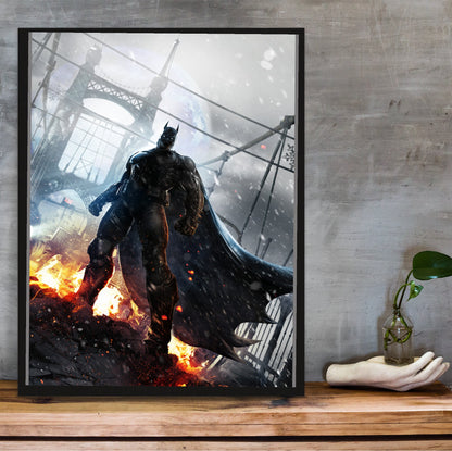 Batman Arkham Origins Batman rooftop promo art poster in a black frame on a wooden shelf against concrete