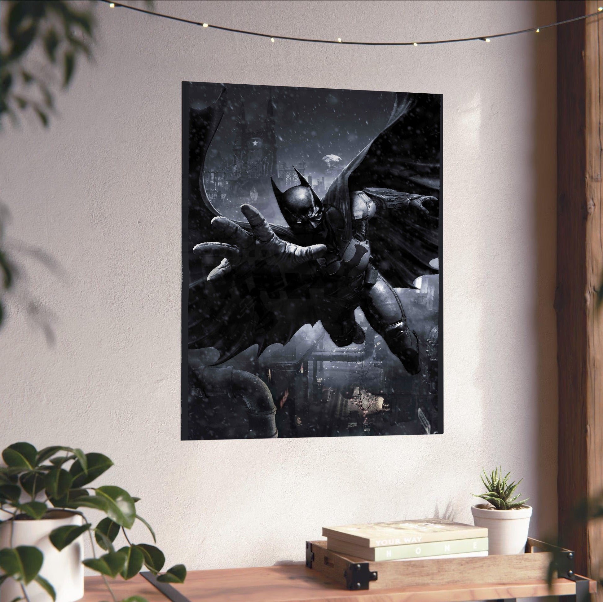 Batman Arkham Origins Batman gliding promo art poster unframed on a white wall above a desk