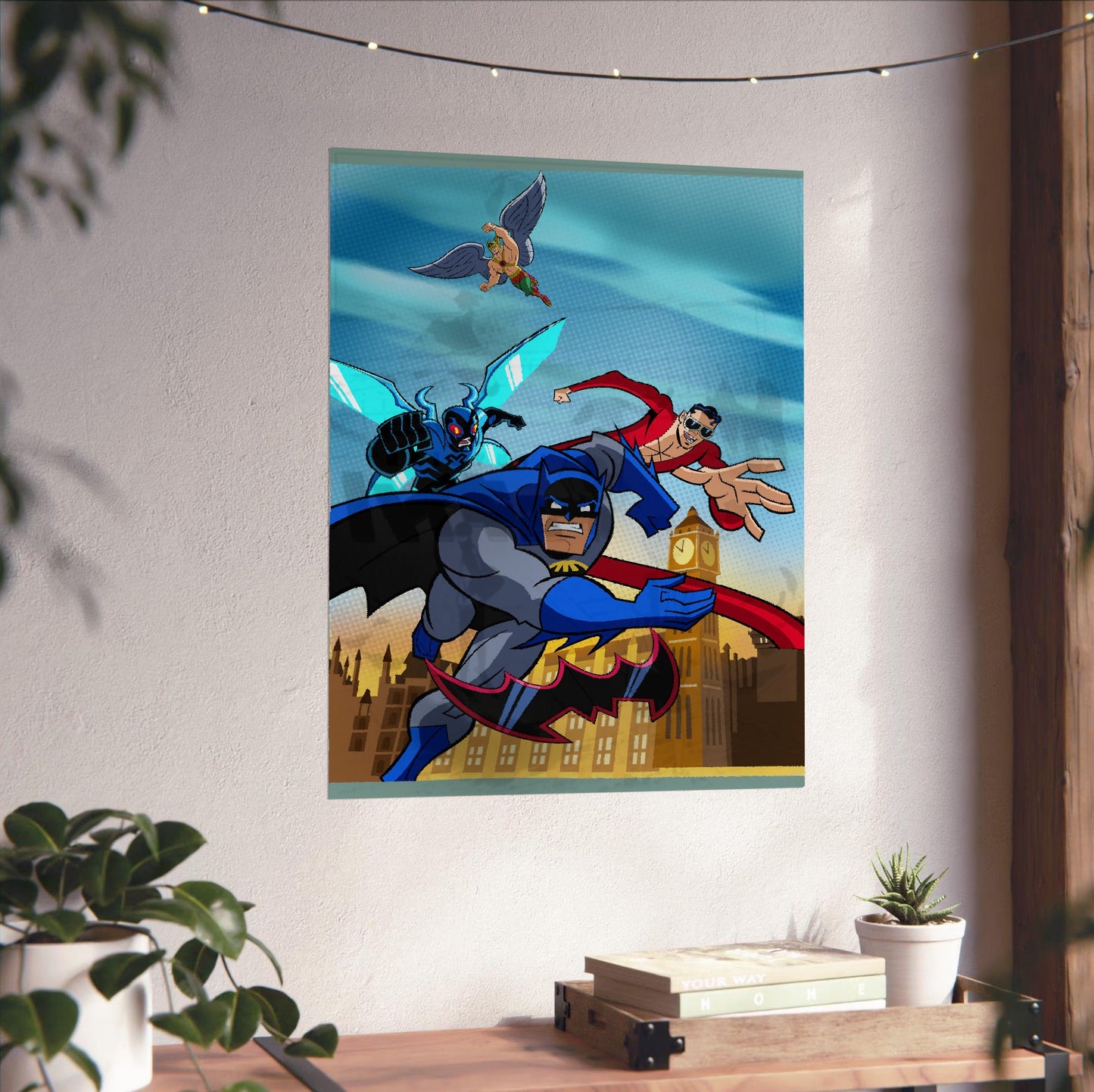Batman The Brave and the Bold videogame cover art poster unframed on a white wall above a desk