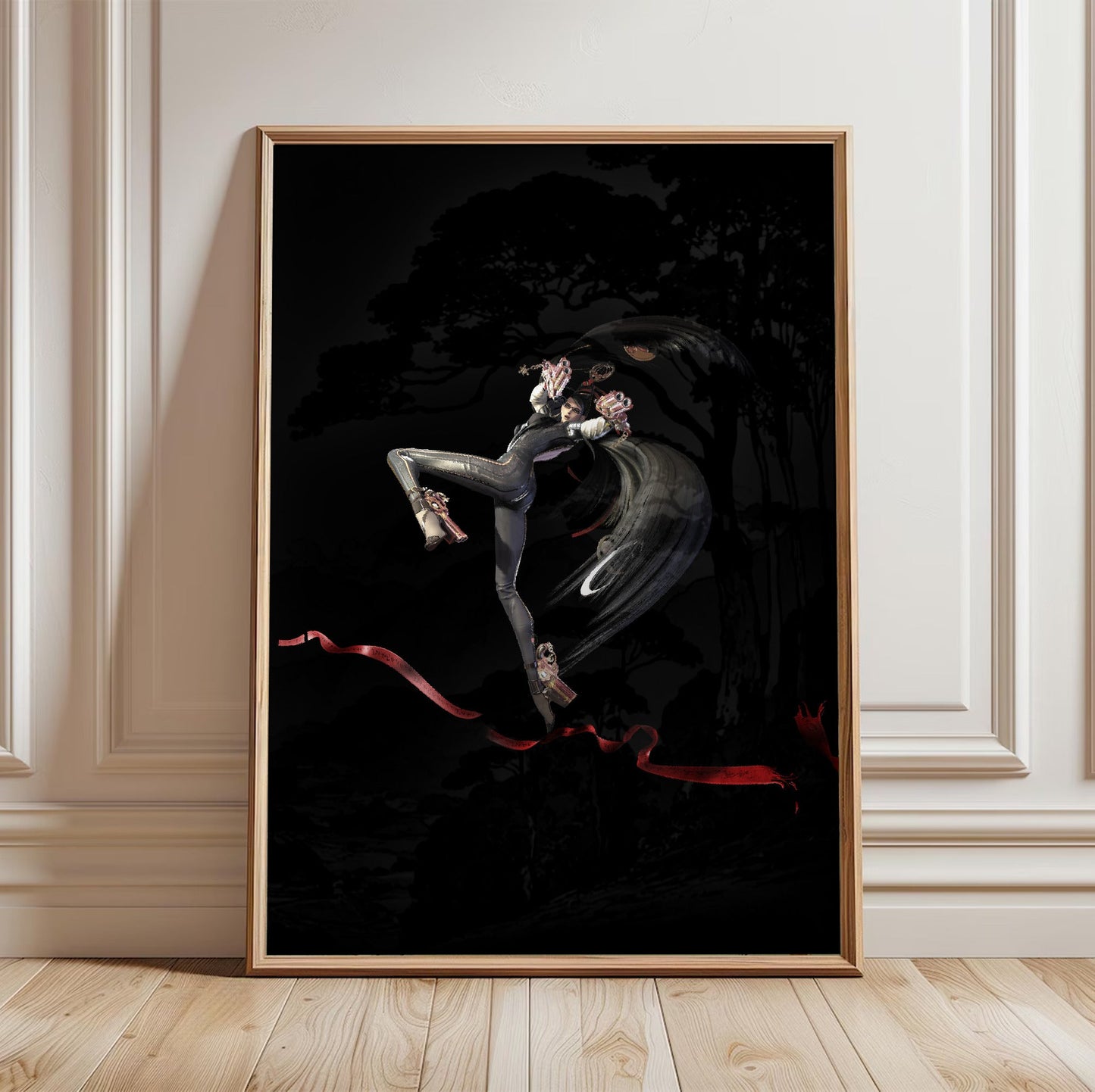Bayonetta action pose art poster in a light oak frame leaning against a white wall