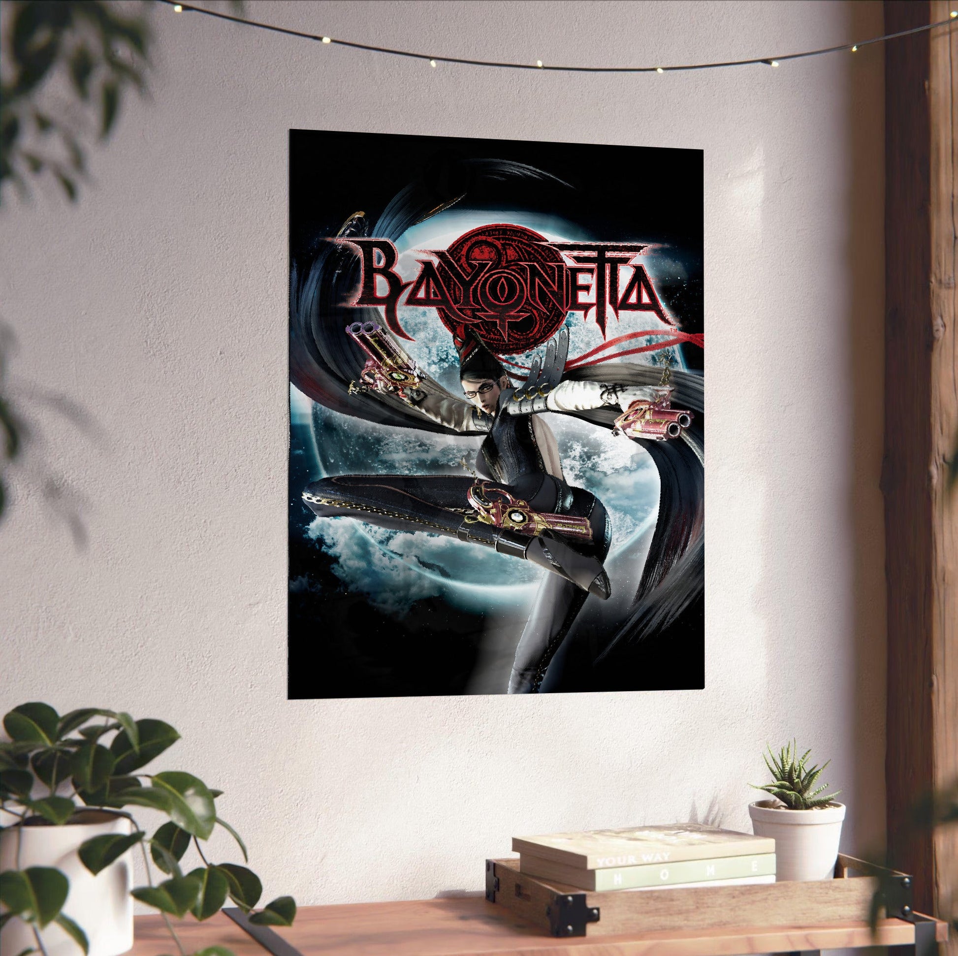 Bayonetta official cover art poster unframed on a white wall above a desk