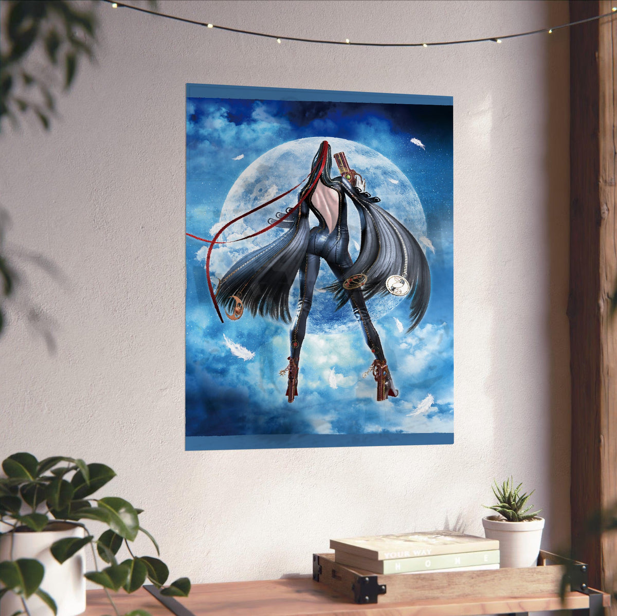 Bayonetta moonlight key art poster unframed on a white wall above a desk
