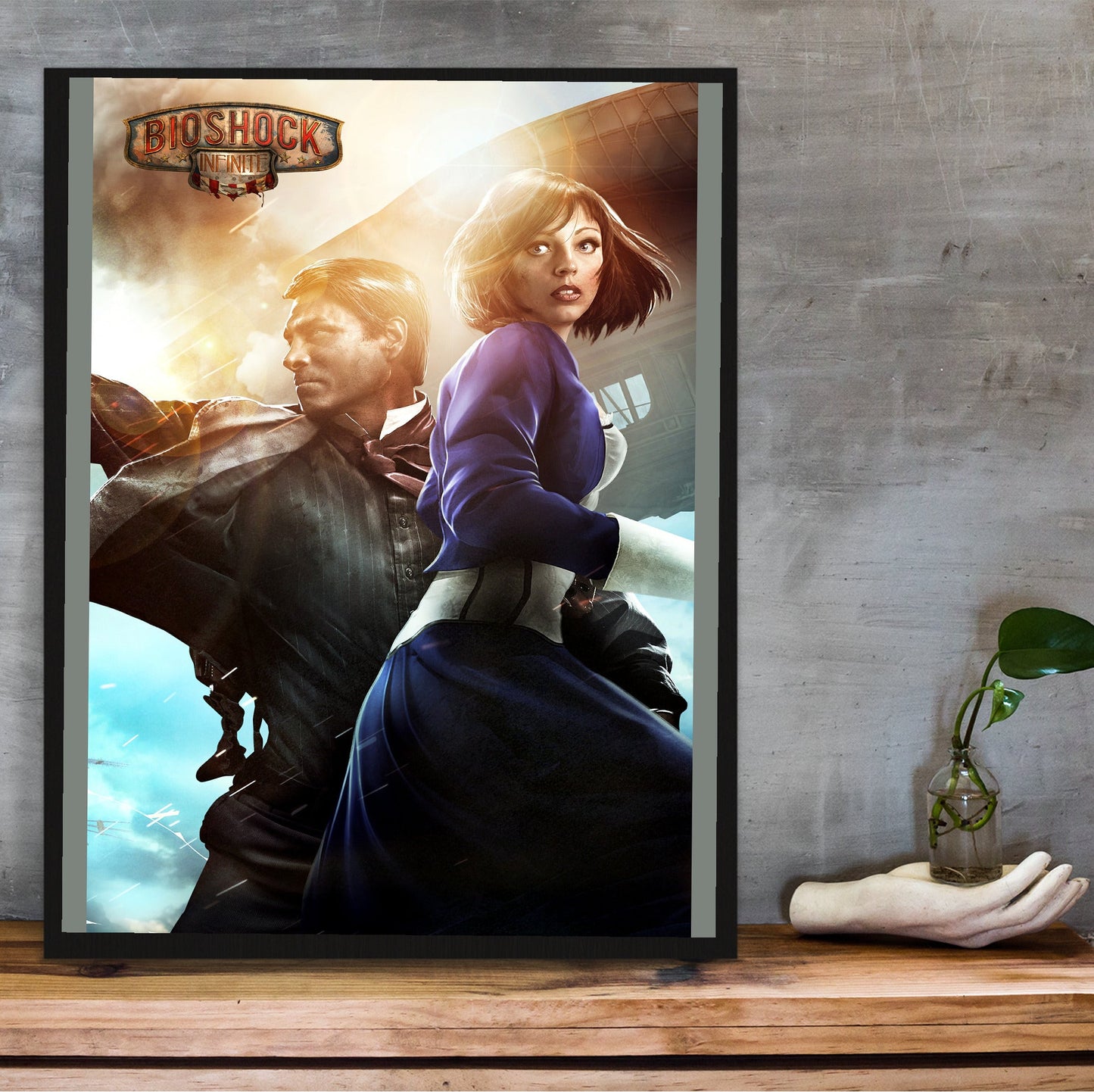BioShock Infinite key art poster hung above a desk