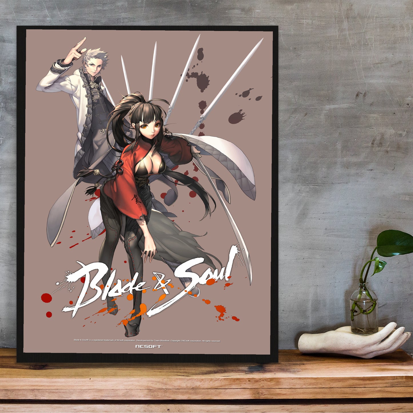 Blade & Soul Jin poster hung above a desk