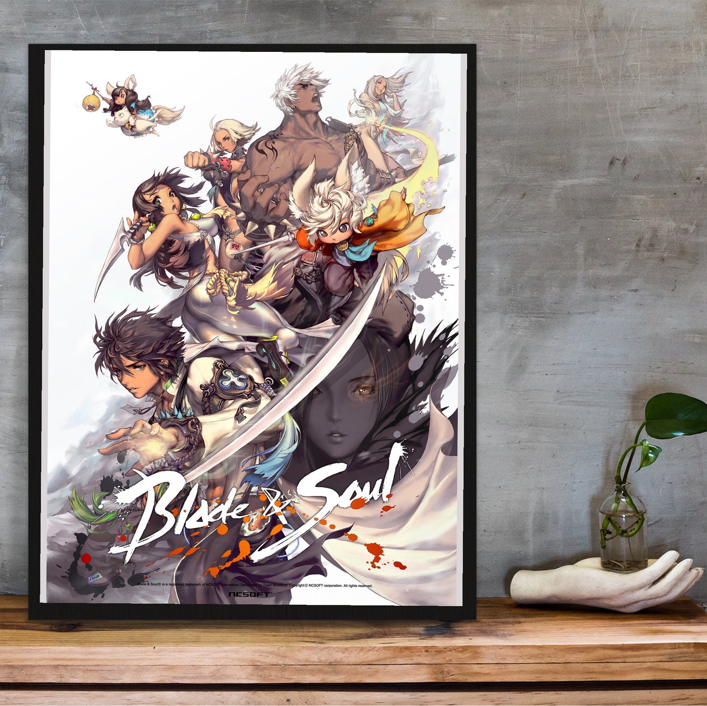 Blade & Soul full cast poster hung above a desk