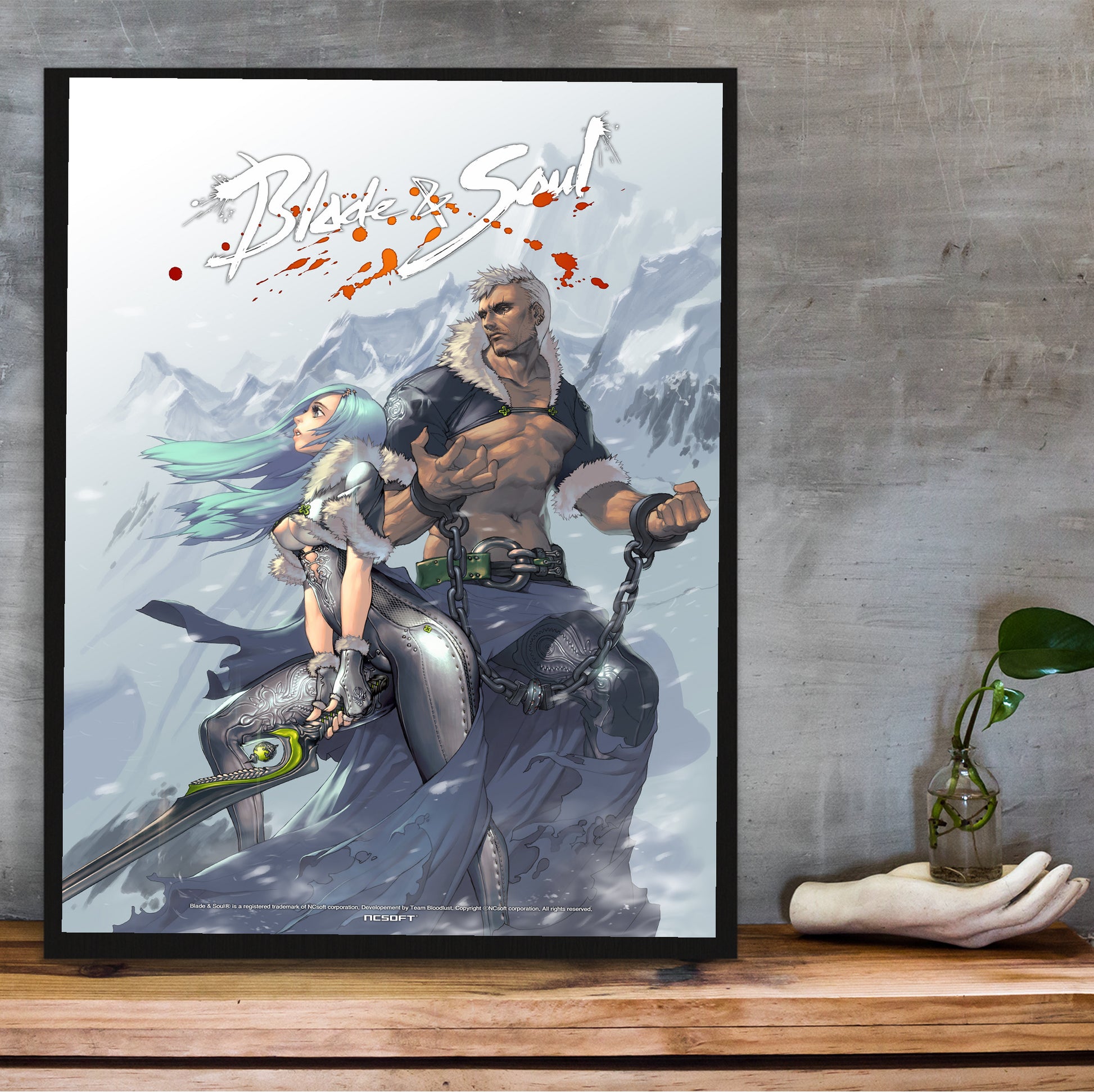 Blade & Soul snowfield poster hung above a desk