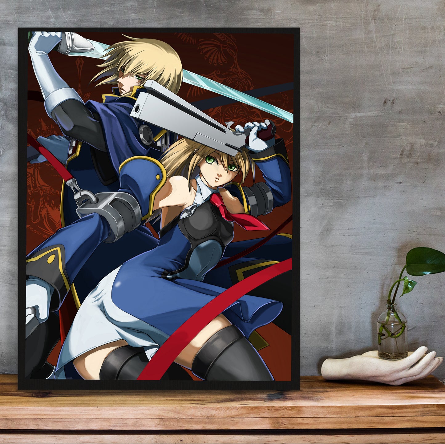 BlazBlue Jin and Noel poster hung above a desk