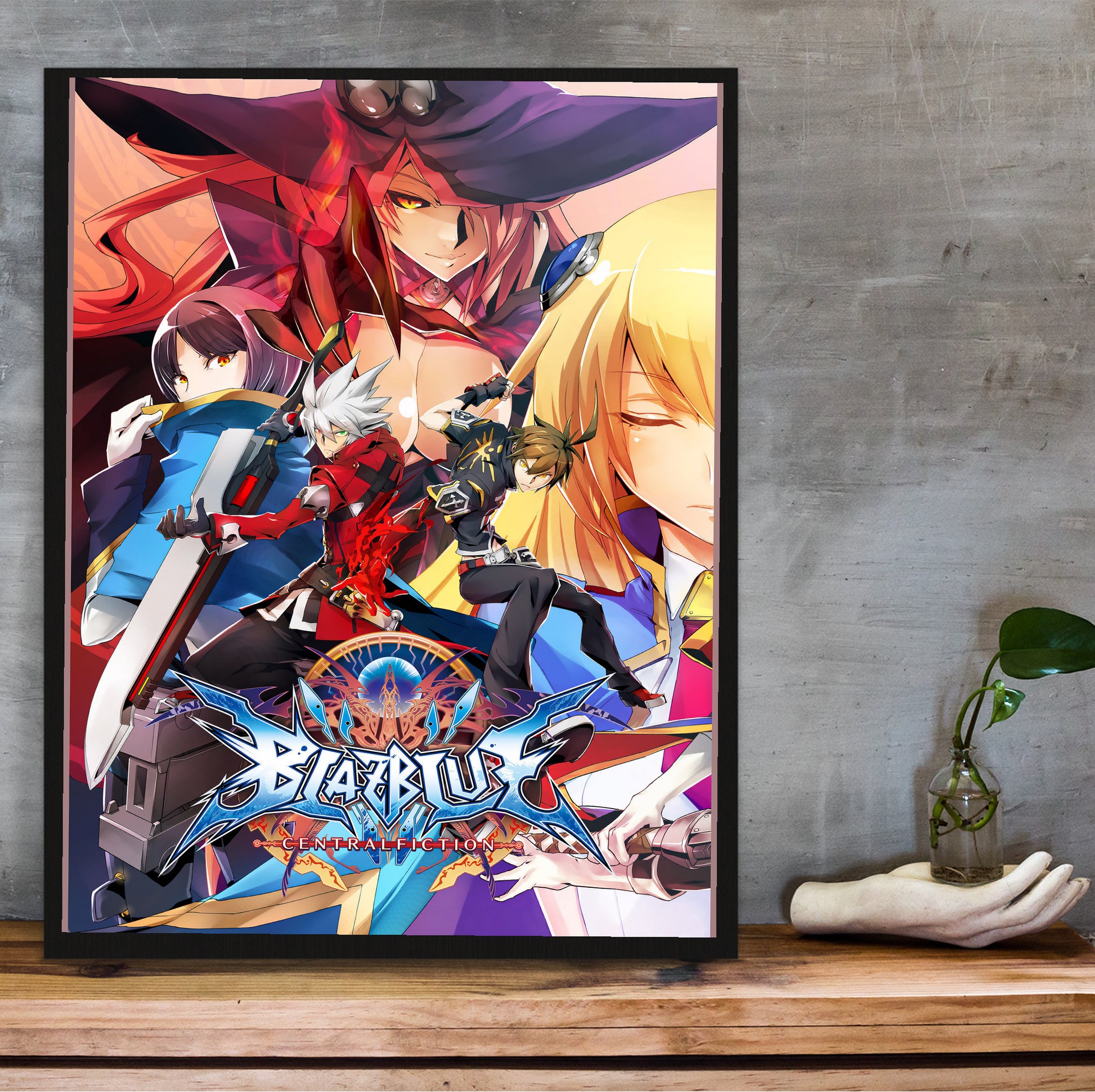 BlazBlue Central Fiction key artwork poster hung above a desk