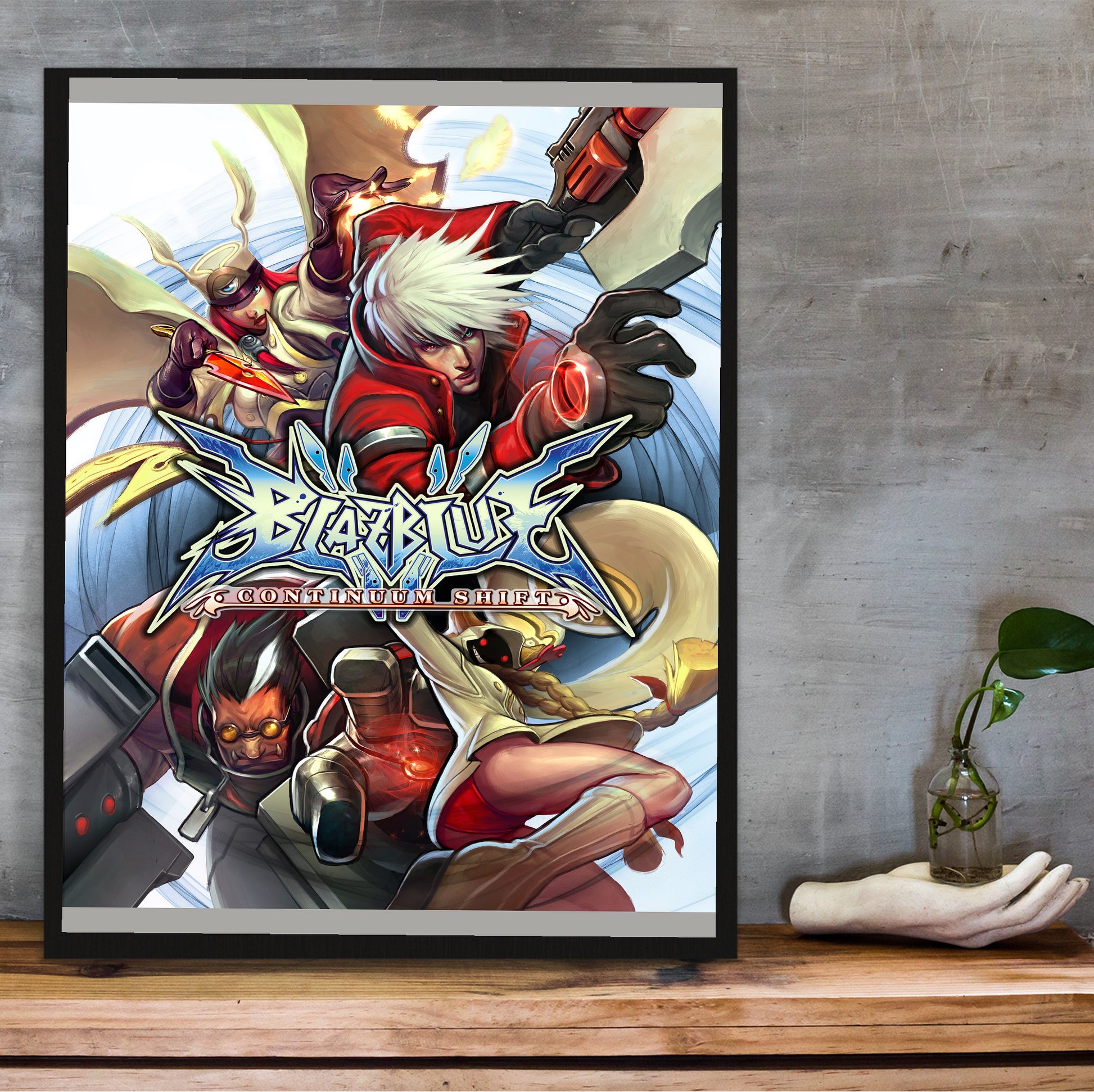 BlazBlue Continuum Shift poster hung above a desk