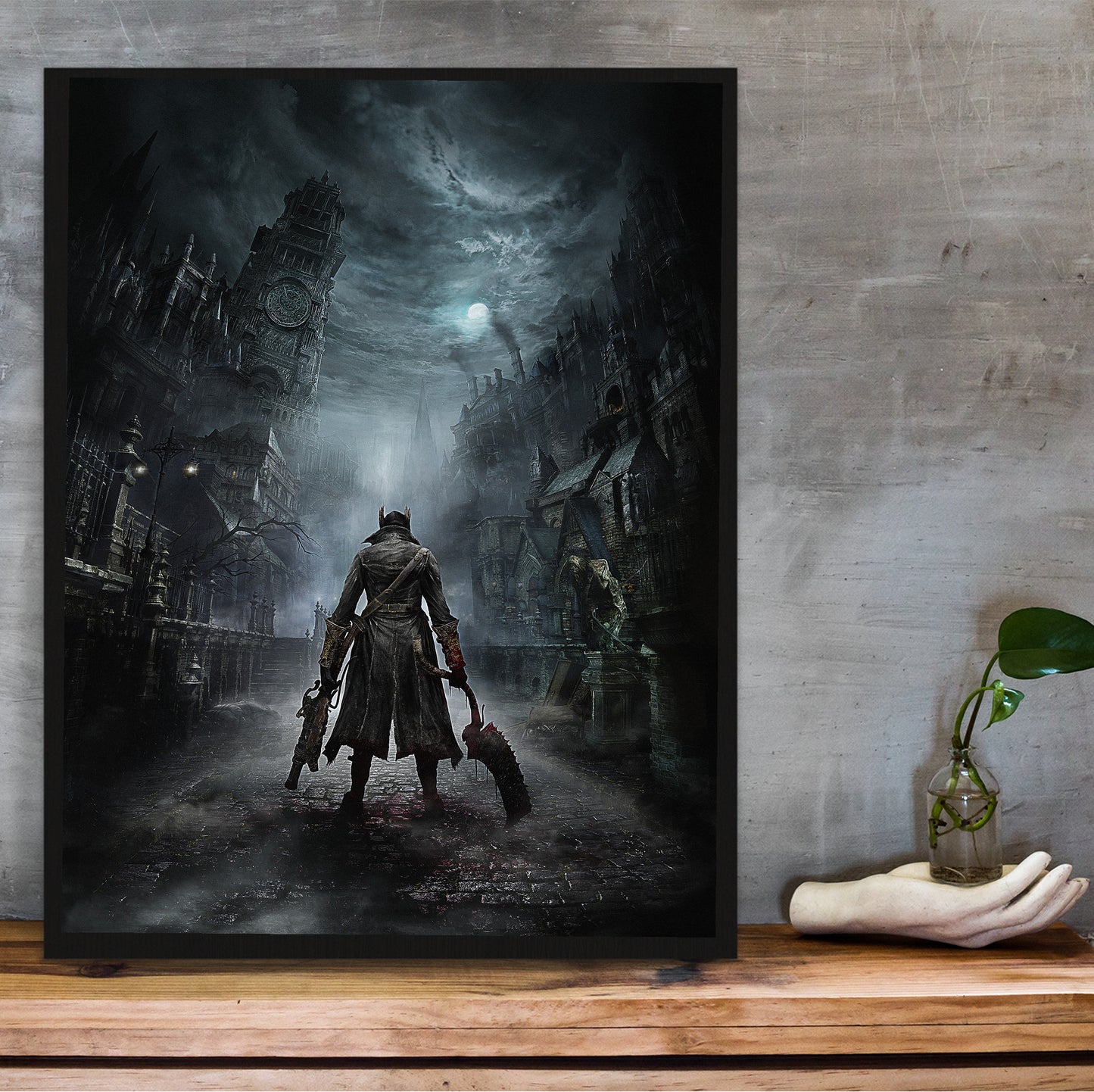 Bloodborne Yharnam key art poster hung above a desk