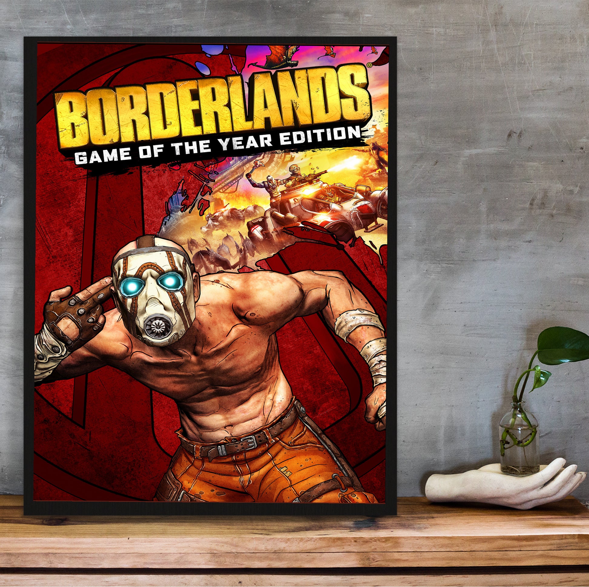 Borderlands Game of the Year Edition poster hung above a desk